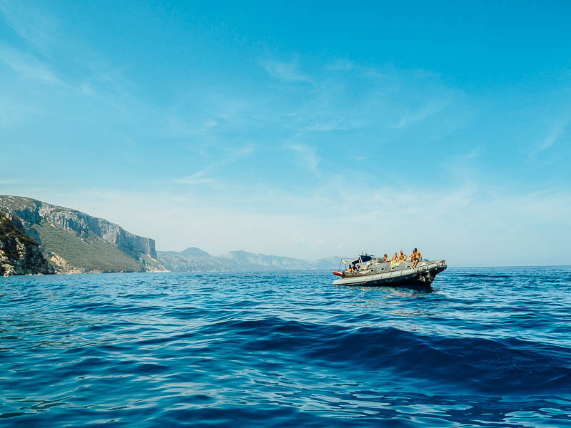 Small boat in the emerald waters of Golfo di Orosei